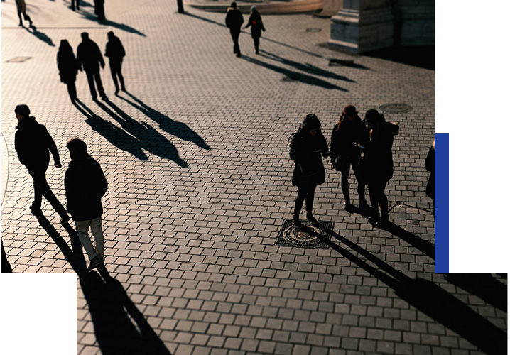 Scene with people in a town square casting shadows