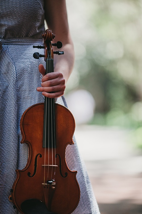 MMusic student holding a violin