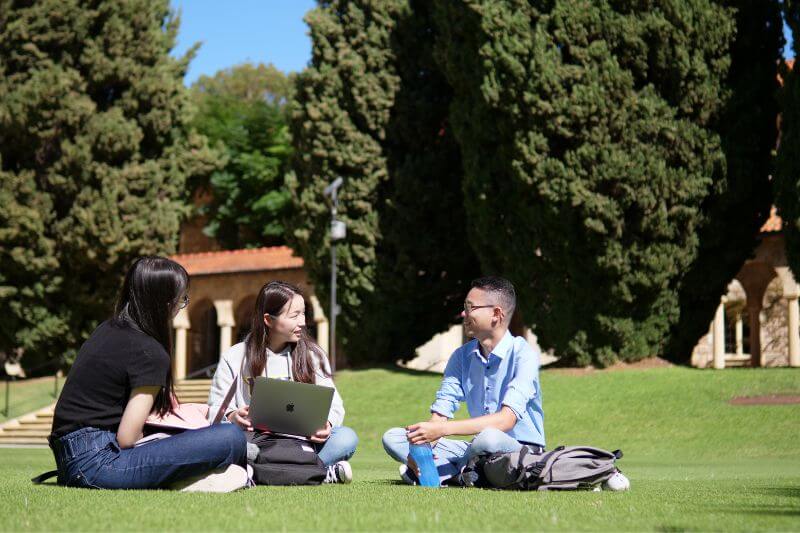 International students sitting on UWA campus