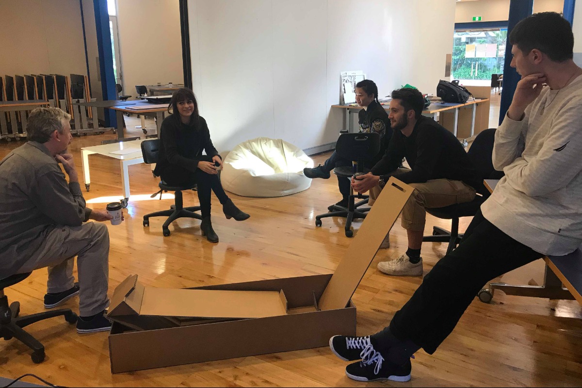 Students and tutors talking about a project at the UWA School of Design