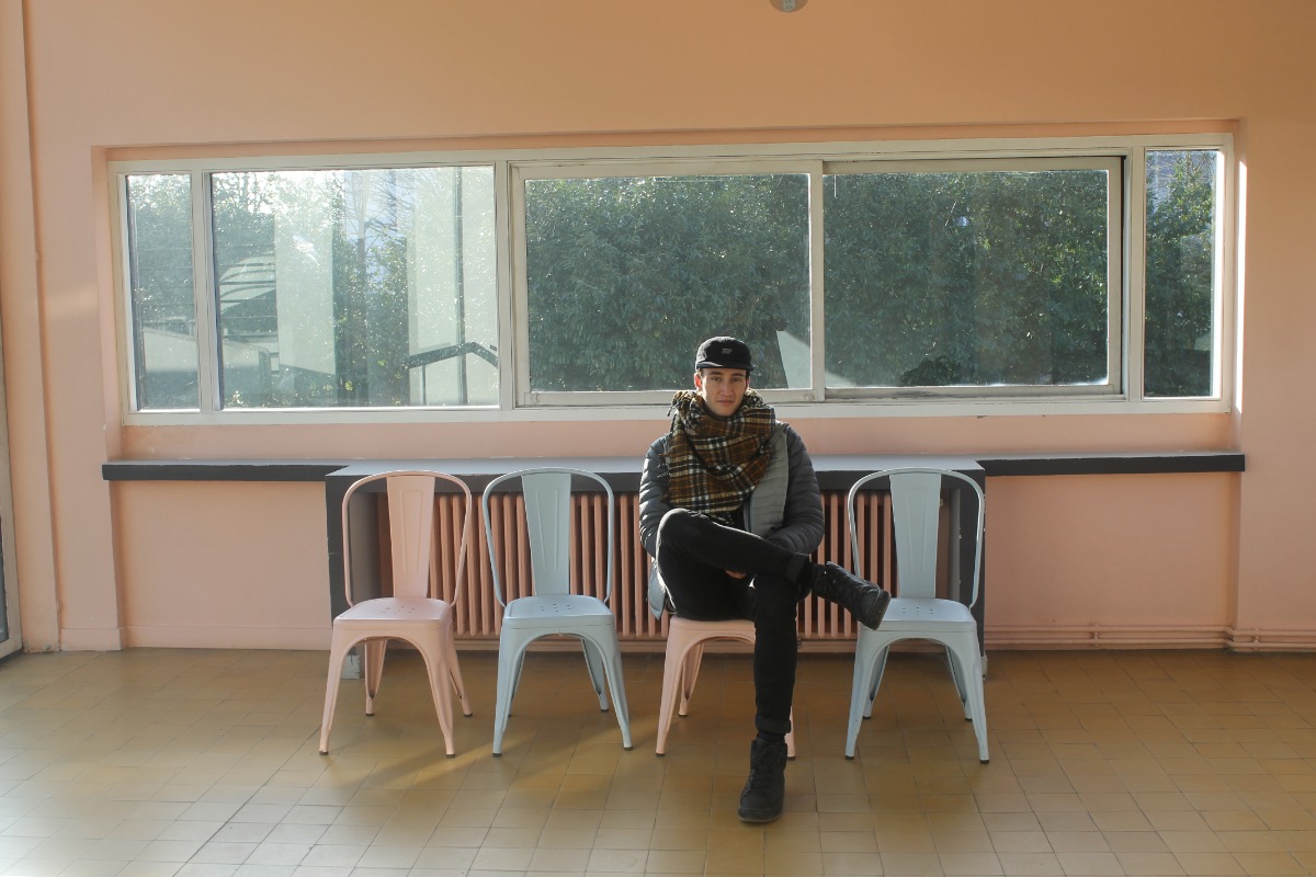 Nic sitting in a room at Le Corbusier's Villa Savoye near Paris