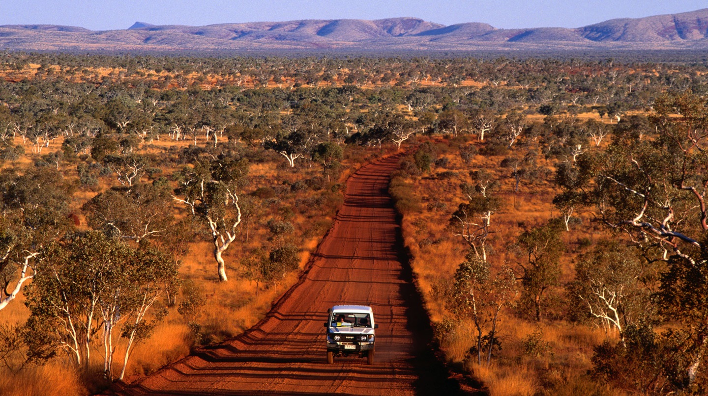 4WD driving down dirt road in the Pilbara Western Australia