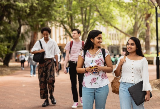students walking and talking around university