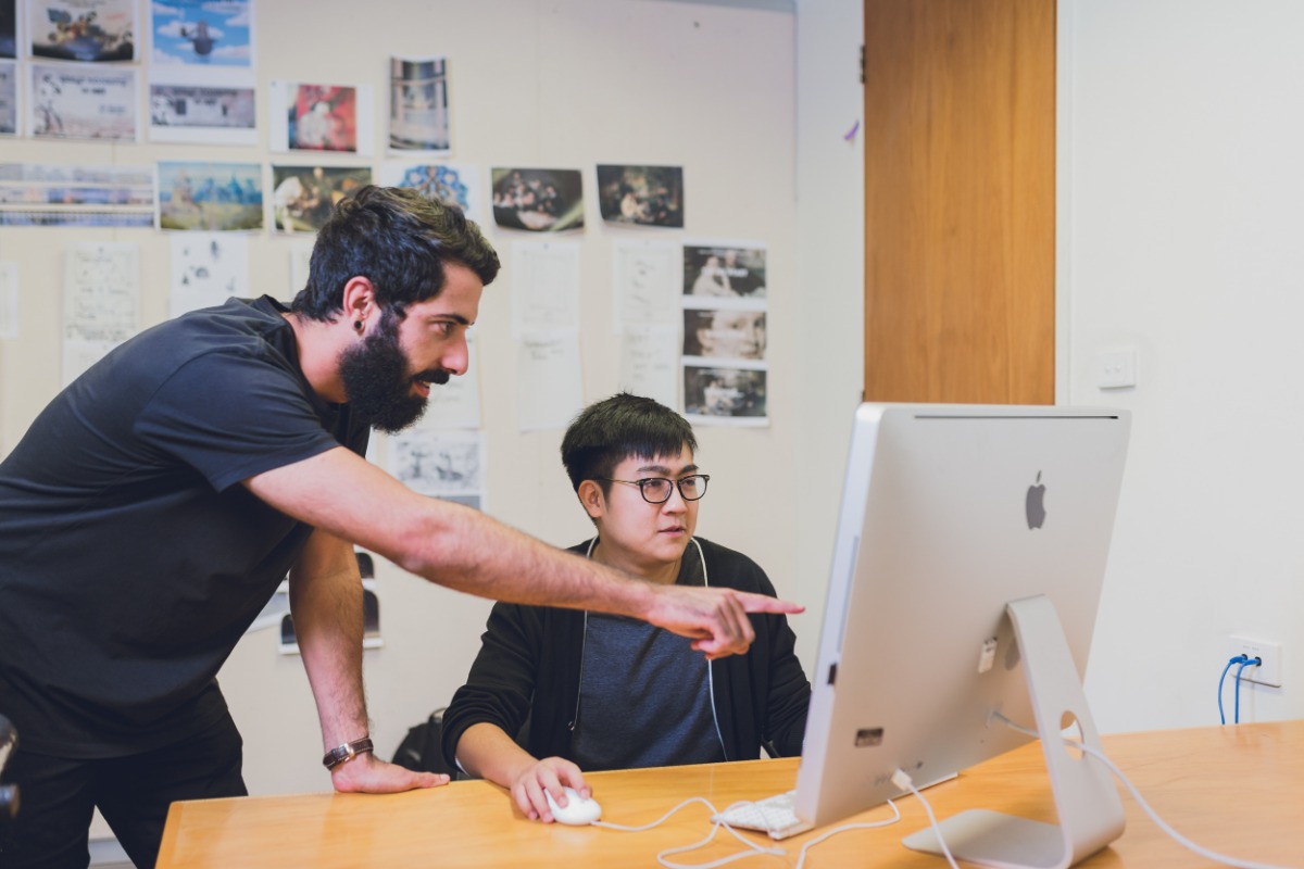 UWA School of Design students working on a computer