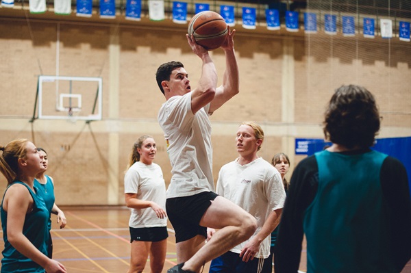 Students play basketball together at the UWA Recreation and Fitness Centre