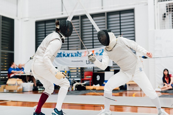 Two students compete in Fencing