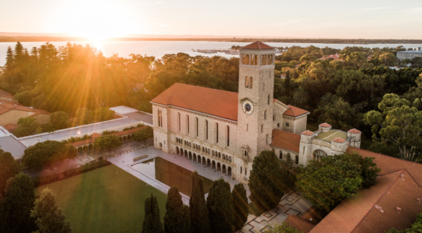 A drone photo of Winthrop Hall at Sunrise