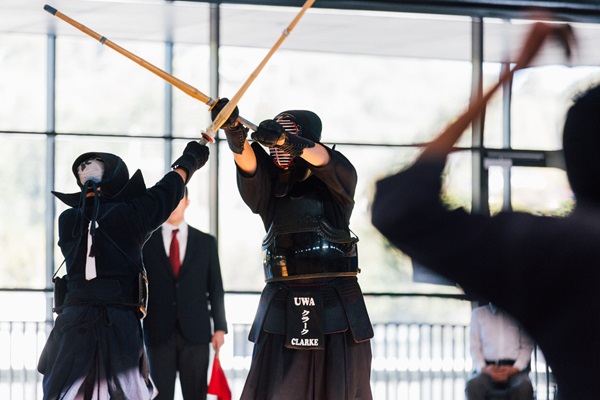 Two student athletes participate in a Kendo match