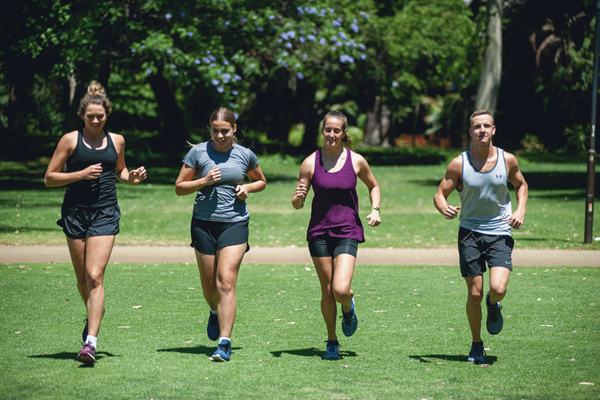 Student athletes captured running during a 2019 fitness photoshoot