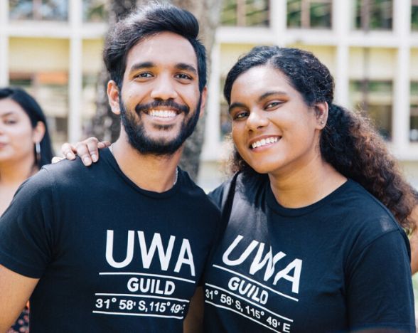 Two member of UWA Student Guild arm in arm at Orientation events