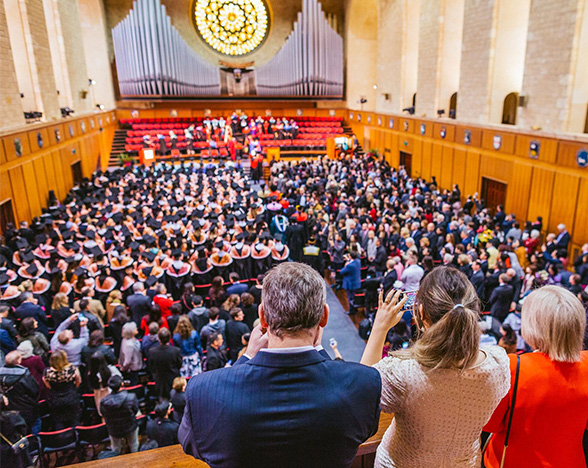 View of graduation ceremony from the balcony of Winthrop Hall