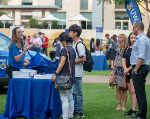 Prospective students at UWA open day booth