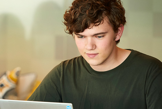 Student working on a laptop computer