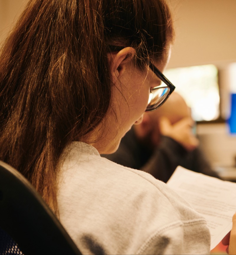 Student reading a university paper