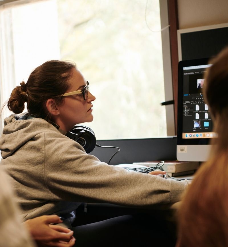 Person editing on a computer