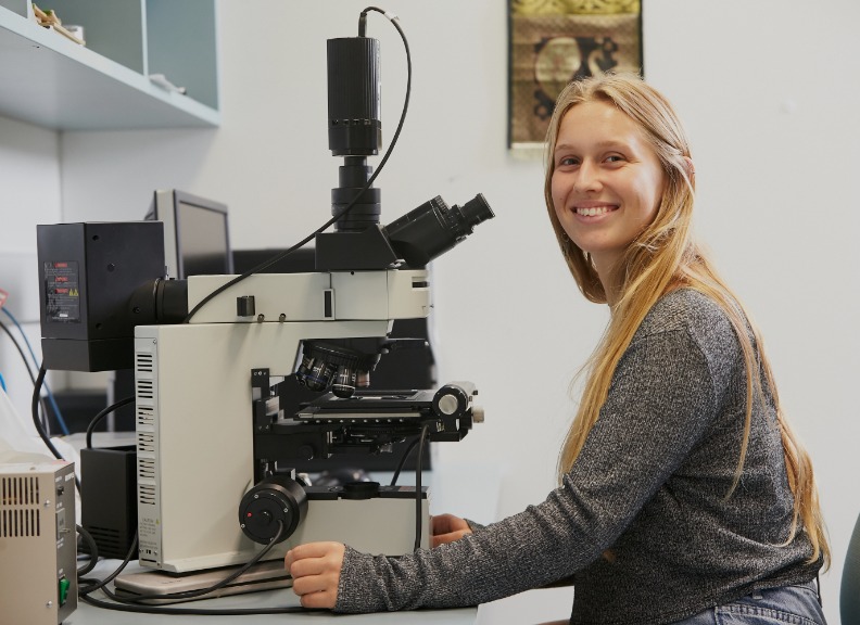 Student with microscope