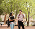 Two students standing outside and talking