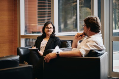 Two people sitting and talking