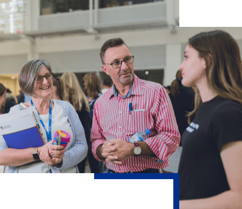 Career adviser in discussion with a staff member and a student