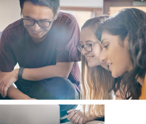 students working together over a laptop