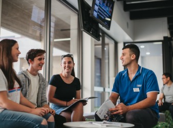 Students talking to a UWA staff member