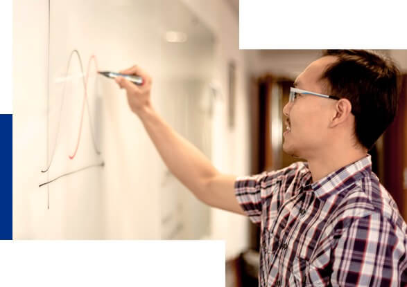 Student working a whiteboard