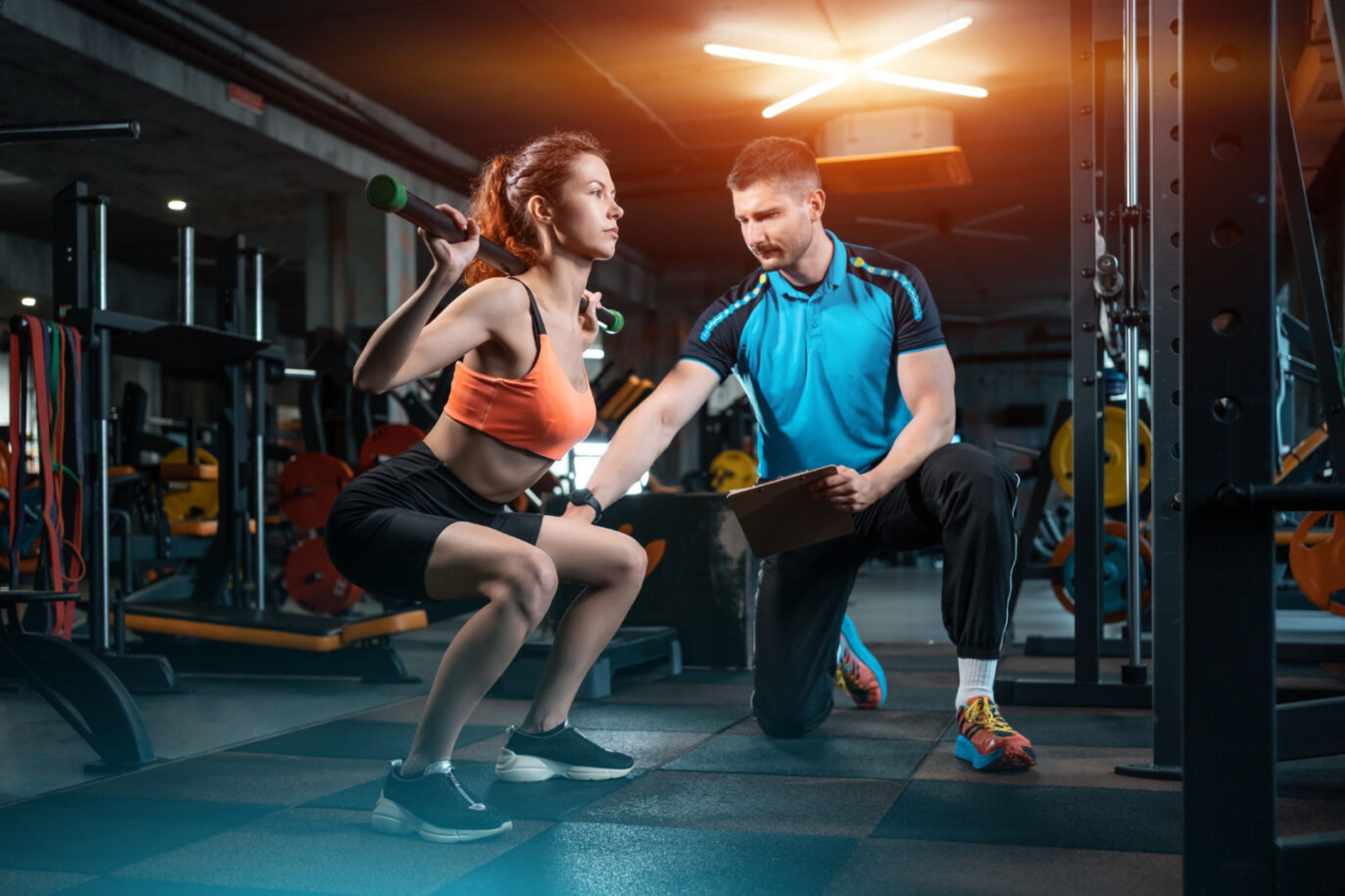 Female in gym with male trainer