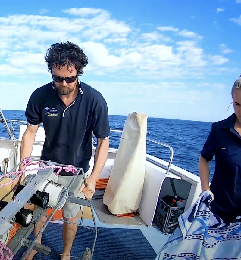 Marine researchers on a boat in the Ningaloo Reef